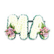 The photograph captures a dignified MA funeral letter tribute, set against a plain white background so every floral detail stands out clearly, as if prepared by a local West Norwood florist who understands the importance of a final goodbye. Both letters are large, block capitals, and their surfaces are completely covered in pristine white chrysanthemums. The flowers are arranged in tight, uniform rows, creating a consistent, cushion-like texture where only the soft curve of each petal and the subtle dome of the centres break the smoothness. Around the edge of each letter runs a narrow border of dark green, probably pleated ribbon or tightly arranged greenery, giving a clean outline that enhances the readability of the M and the A from a distance-ideal for viewing during a procession or graveside service. Adding a gentle, emotional accent, two small floral sprays sit at the bottom of the design: one at the base of the M on the left, and another at the base of the A on the right. These feature pastel pink and soft lilac roses, along with dainty pink spray roses that nestle between the larger blooms. The rose petals look velvety and delicate, with some blossoms fully open and others still in bud, suggesting layers of shared memories and the continuation of love. Wisps of fern and a few pieces of fresh foliage extend slightly beyond the roses, introducing a sense of movement and natural ease that calls to mind the greenery of nearby West Norwood cemeteries and gardens. Altogether, the piece conveys quiet strength and affectionate remembrance, a fitting floral message from family or friends to a beloved Ma or mother figure.